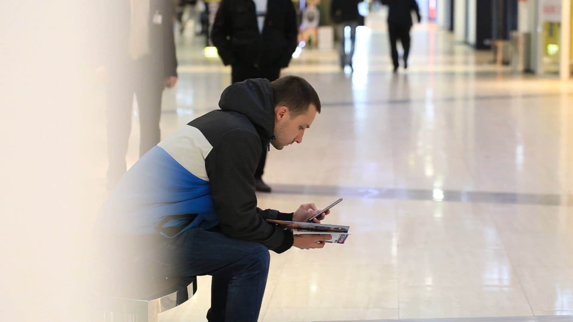 Shoppers moving through a shopping mall.