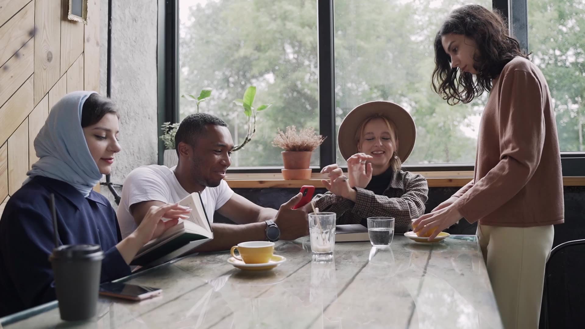 Adults meeting and talking in a social setting.