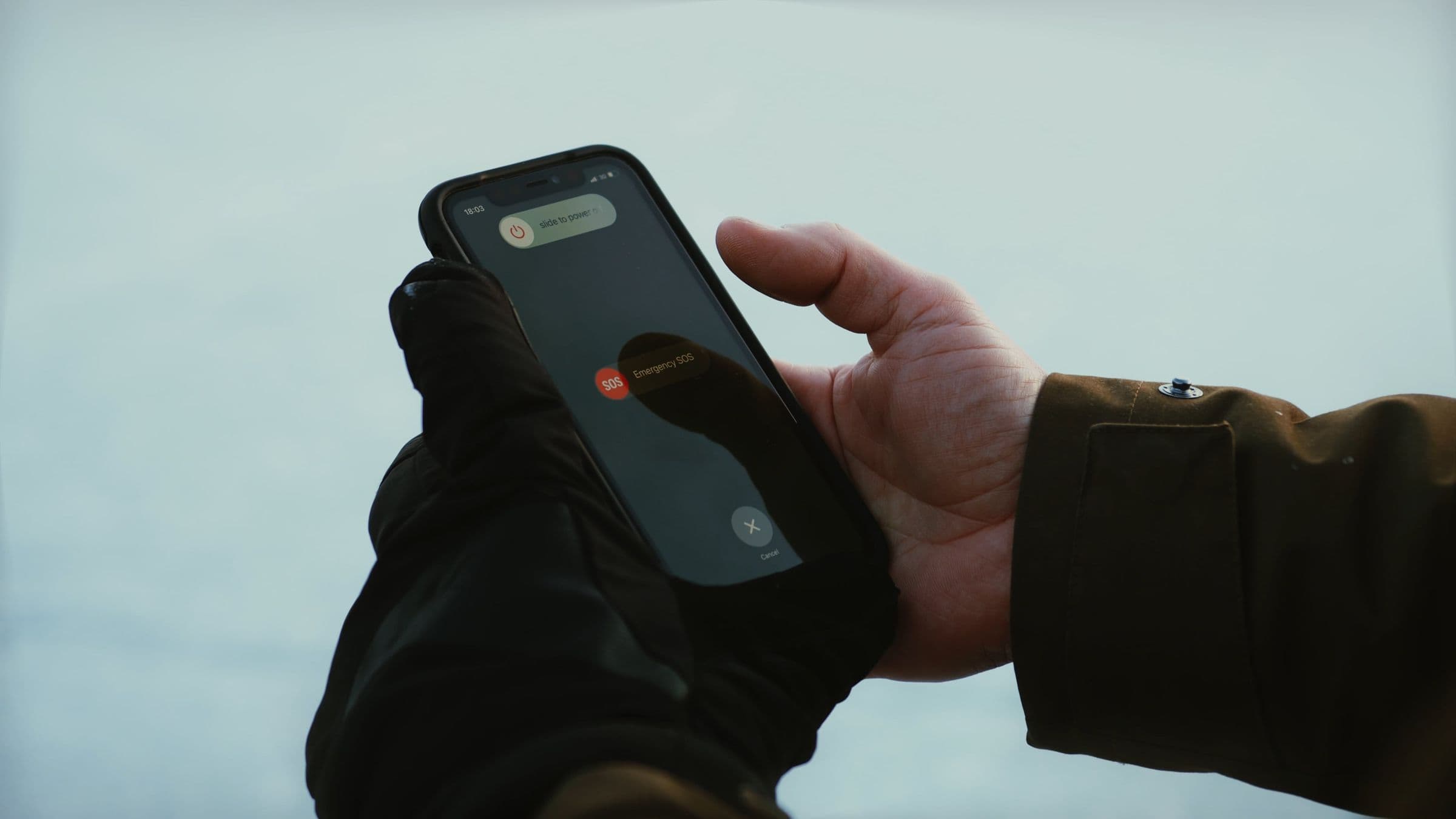 A person using their phone urgently at night.