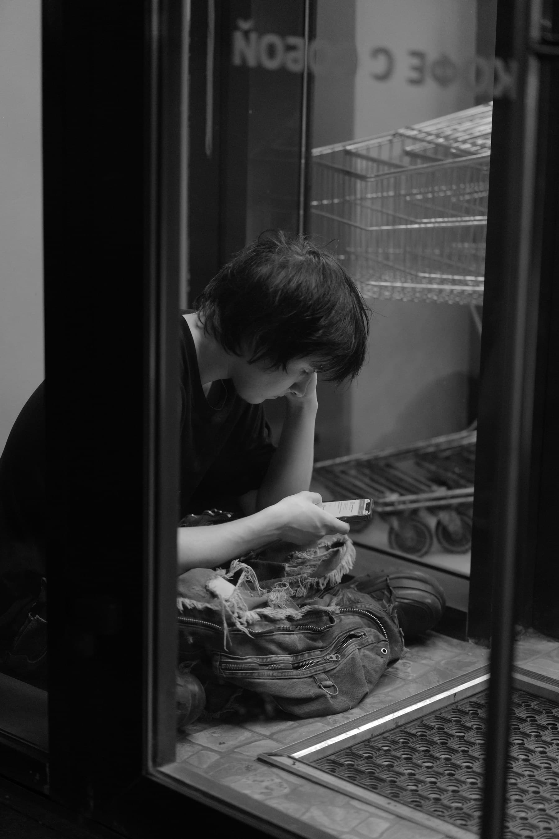 A person checking a phone during a late-night journey