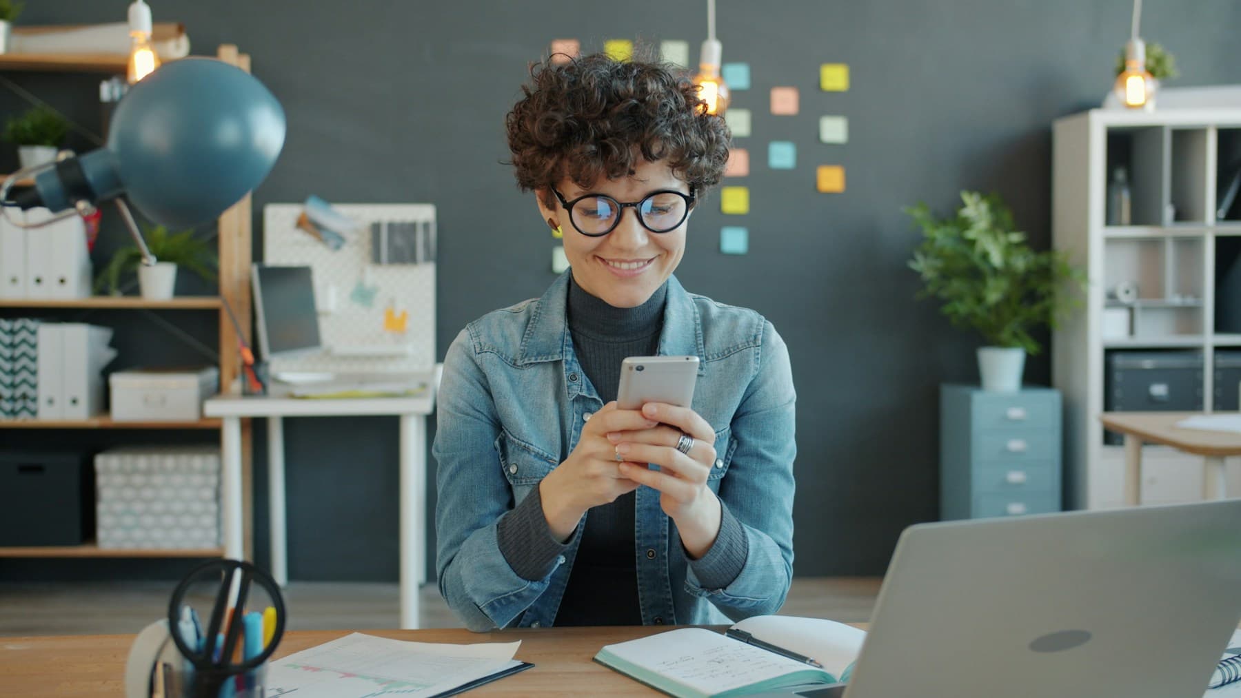 Professional using a phone to coordinate a meeting